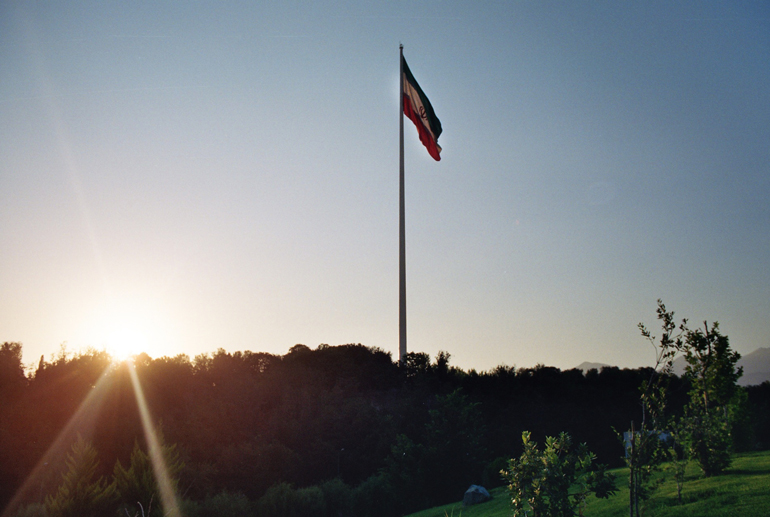 The iranian flag within a Tehran's park. (Picture by Bastien Perroy)